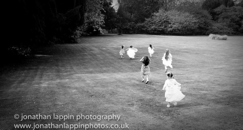 Girls running in the grounds of Brandshatch Place hotel in Kent