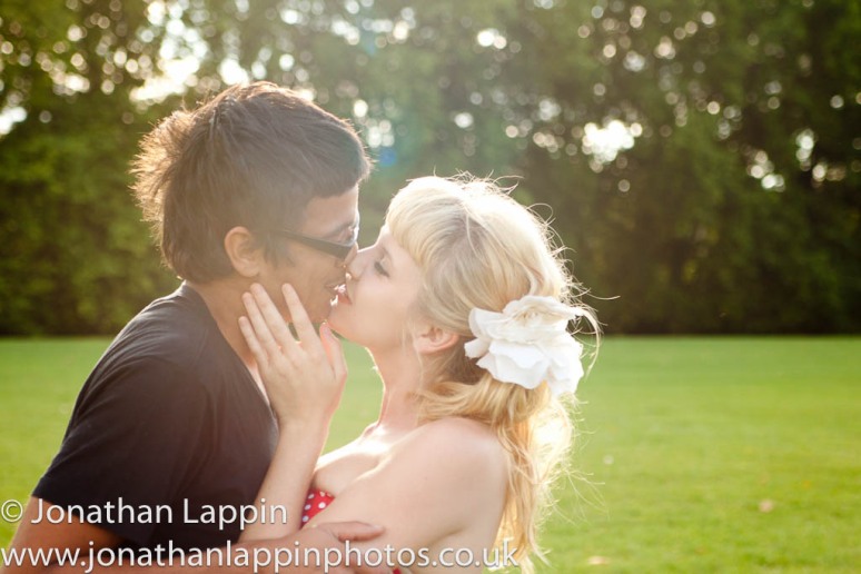 Pedro Franco and Jesse Monroe kissing on Hackney Common engagement shoot by jonathan lappin